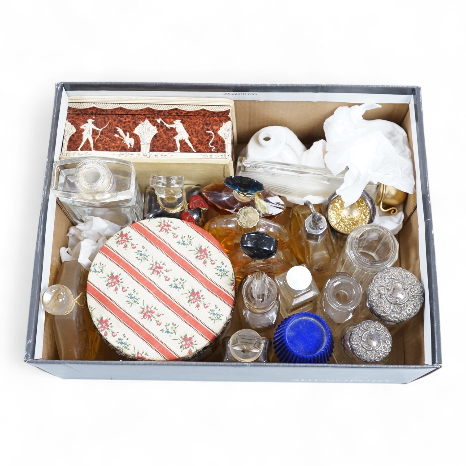 A Baccarat Guerlain perfume bottle in original box and a collection of other empty perfume bottles